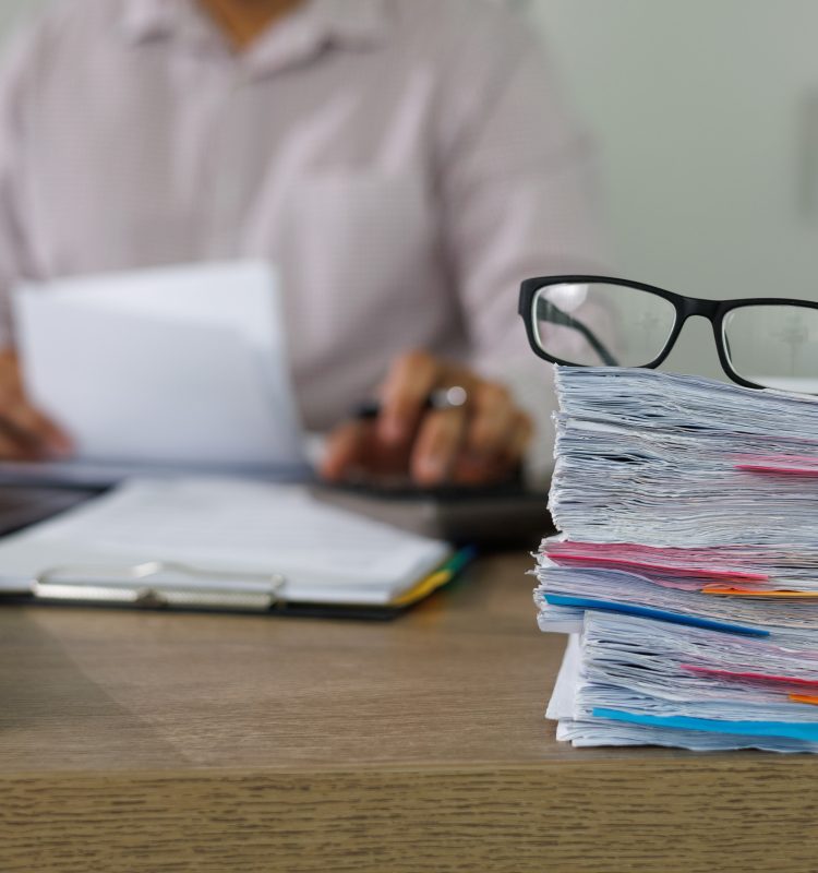 Business Documents concept  document achieves on folders papers at busy work desk office